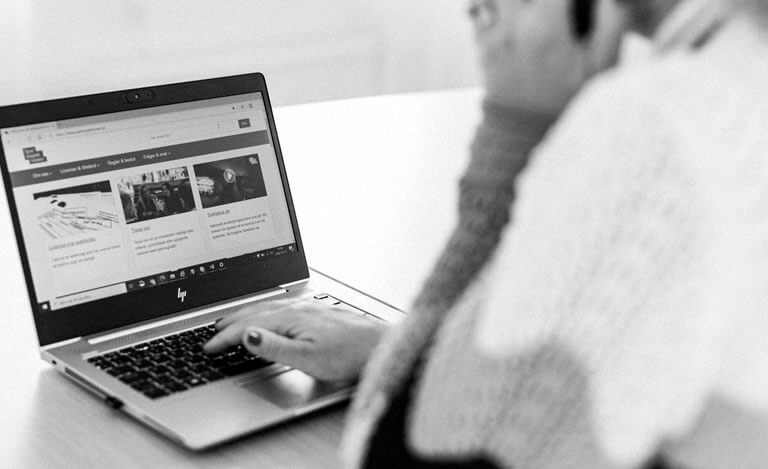 Girl typing on the keyboard of a laptop